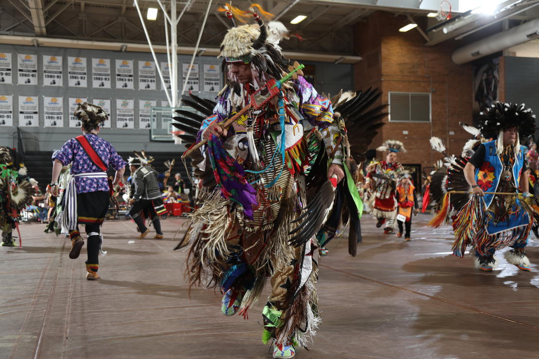 A graphic of the BraveNation Spring PowWow, with dancing