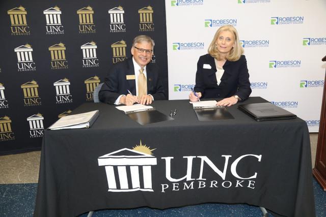 Chancellor Cummings and RCC President Kimberly Gold signed the official agreement
