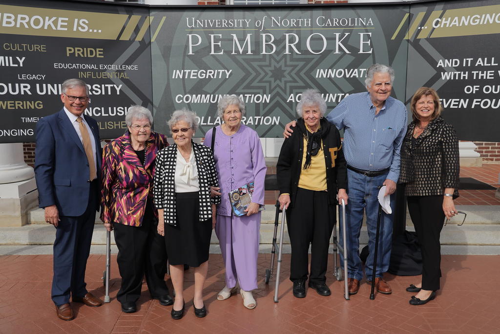 Chancellor Cummings and wife Rebecca are shown with some of the university's oldest living alumni