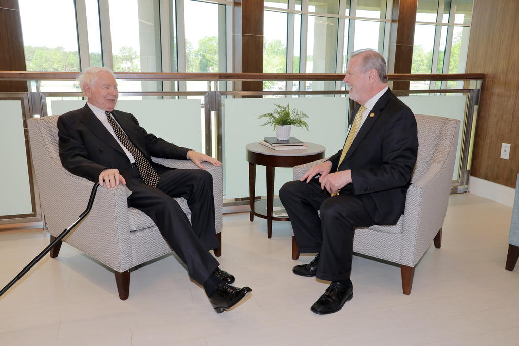 Jim Thomas chats with Senate President Pro Tempore Phil Berger inside the James A. Thomas Hall