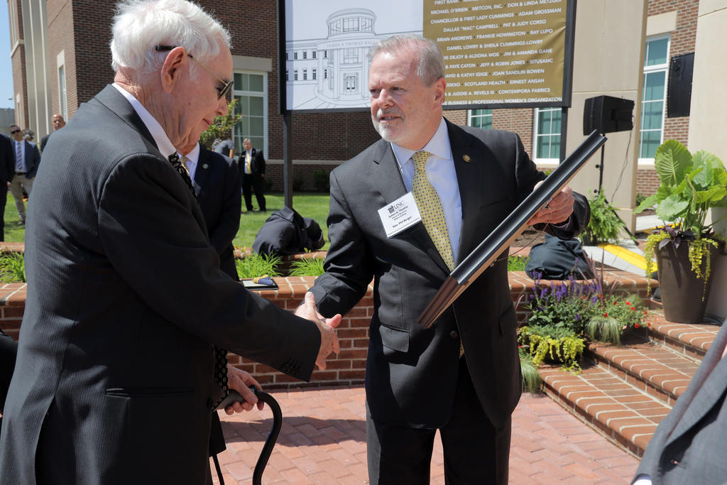 Sen. President Pro Tempore Phil Berger (right) presents Jim Thomas with a special proclamation