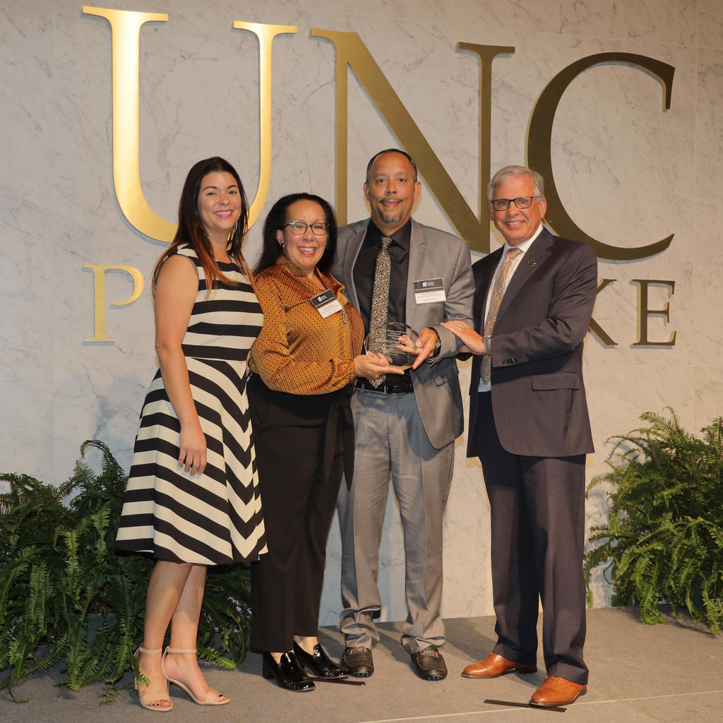Necia Chavis and Greg Brayboy accepted the Outstanding Alumnus Award on behalf of their late parents Hampton and Pattie Brayboy