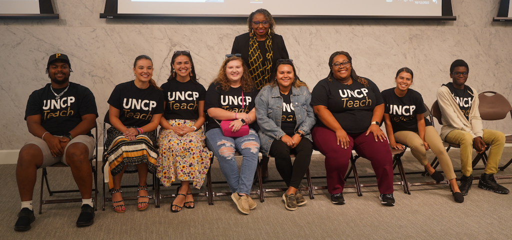 School of Education Dean Loury Floyd (standing) shown with UNCP education majors during a recent Brave Educator for a Day event