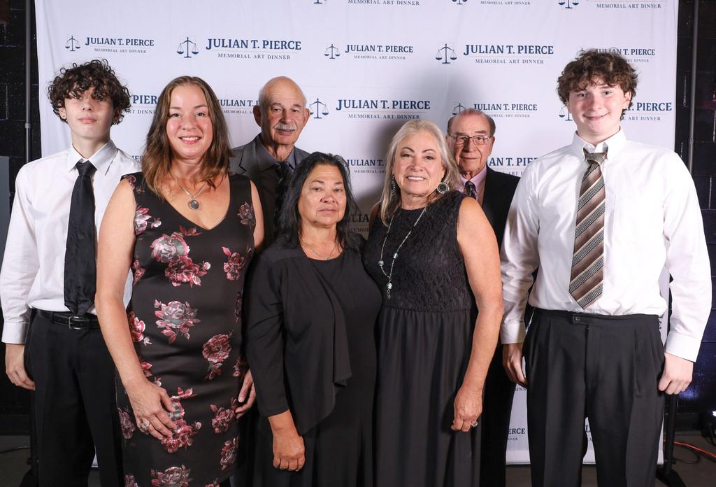 The family of the late Julian Pierce is shown at the memorial art dinner held annually at The University of North Carolina at Pembroke in his honor to raise money for scholarships.