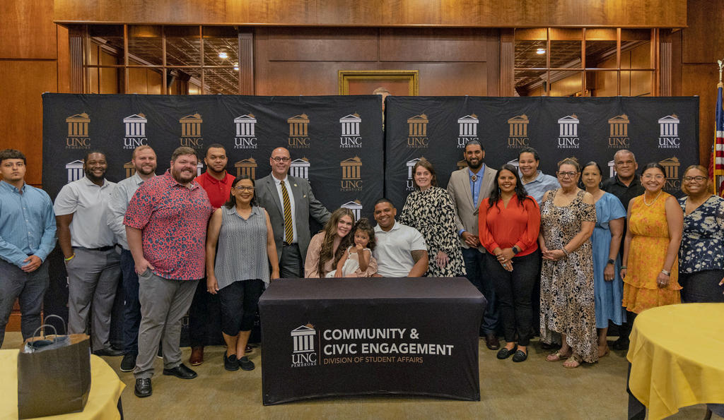 Taley and Jordan Hunt are pictured with UNCP leadership, Community and Civic Engagement staff and volunteers