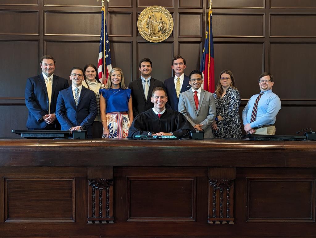 Whitney Peck is pictured with Judge Jefferson Griffin, his staff and other summer interns from the UNC System