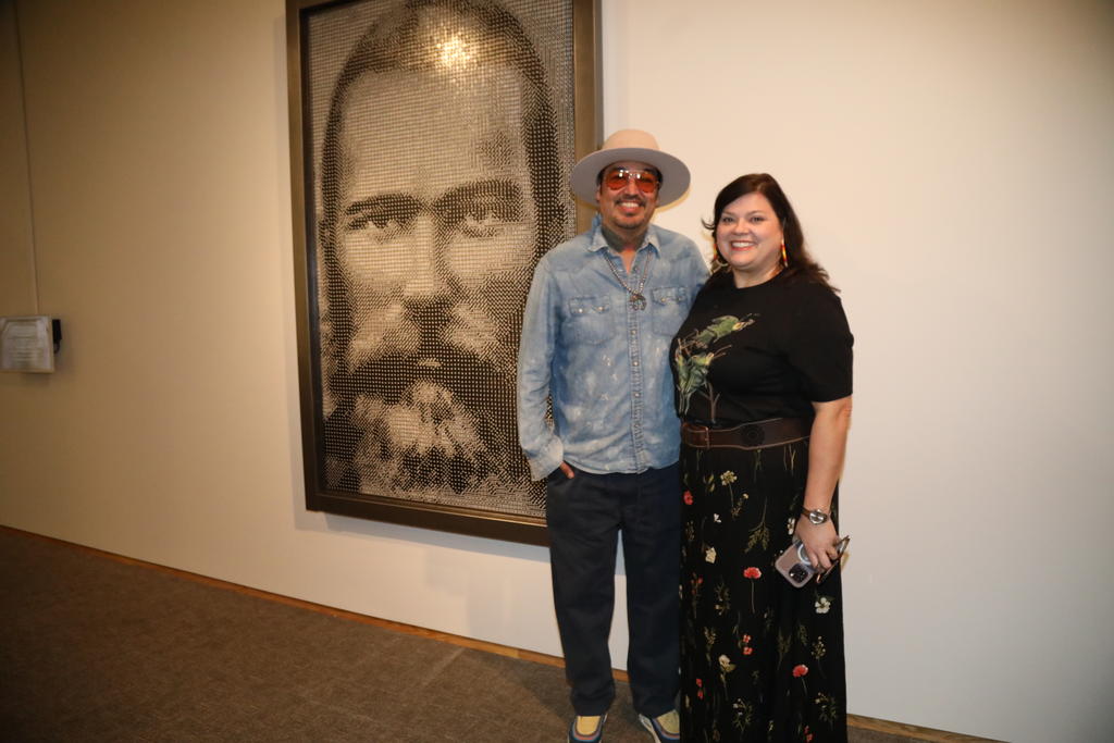 Nancy Strickland Fields (right) with Steven Paul Judd, who designed six-foot-tall, commissioned portrait of Henry Berry Lowrie made of 20,000 dice
