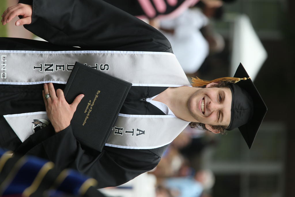 Cody Williams, a member of the wrestling team, at the undergraduate ceremony at Spring Commencement