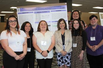 Undergraduate researchers and COMPASS Director Dr. Maria Santisteban (4th from left)