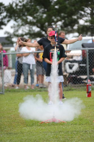 A youth camper launches an A8-3 model rocket during the Cummings Aerospace Engineering Camp at UNC Pembroke on June 23, 2023 