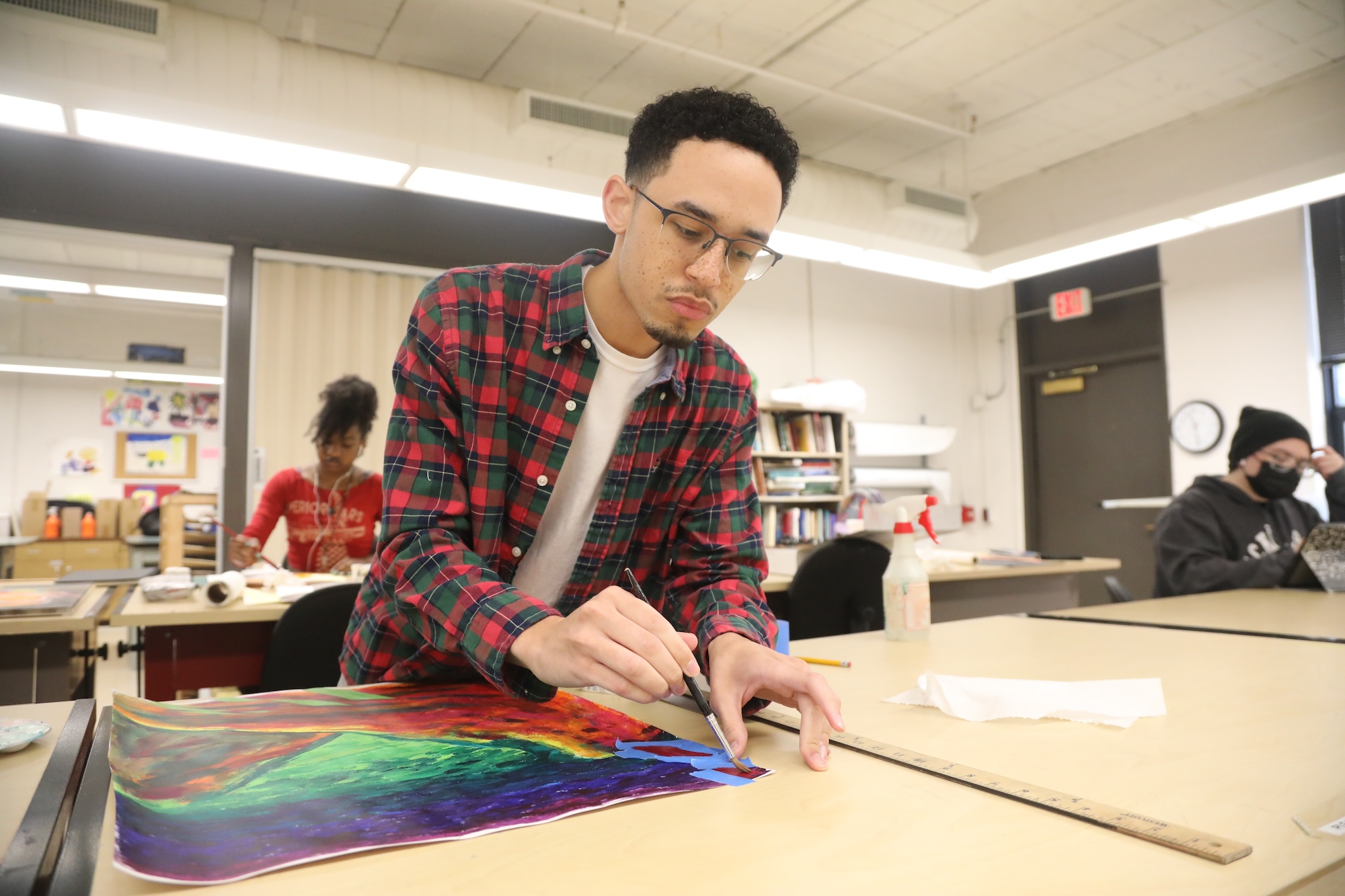 UNCP student painting in class