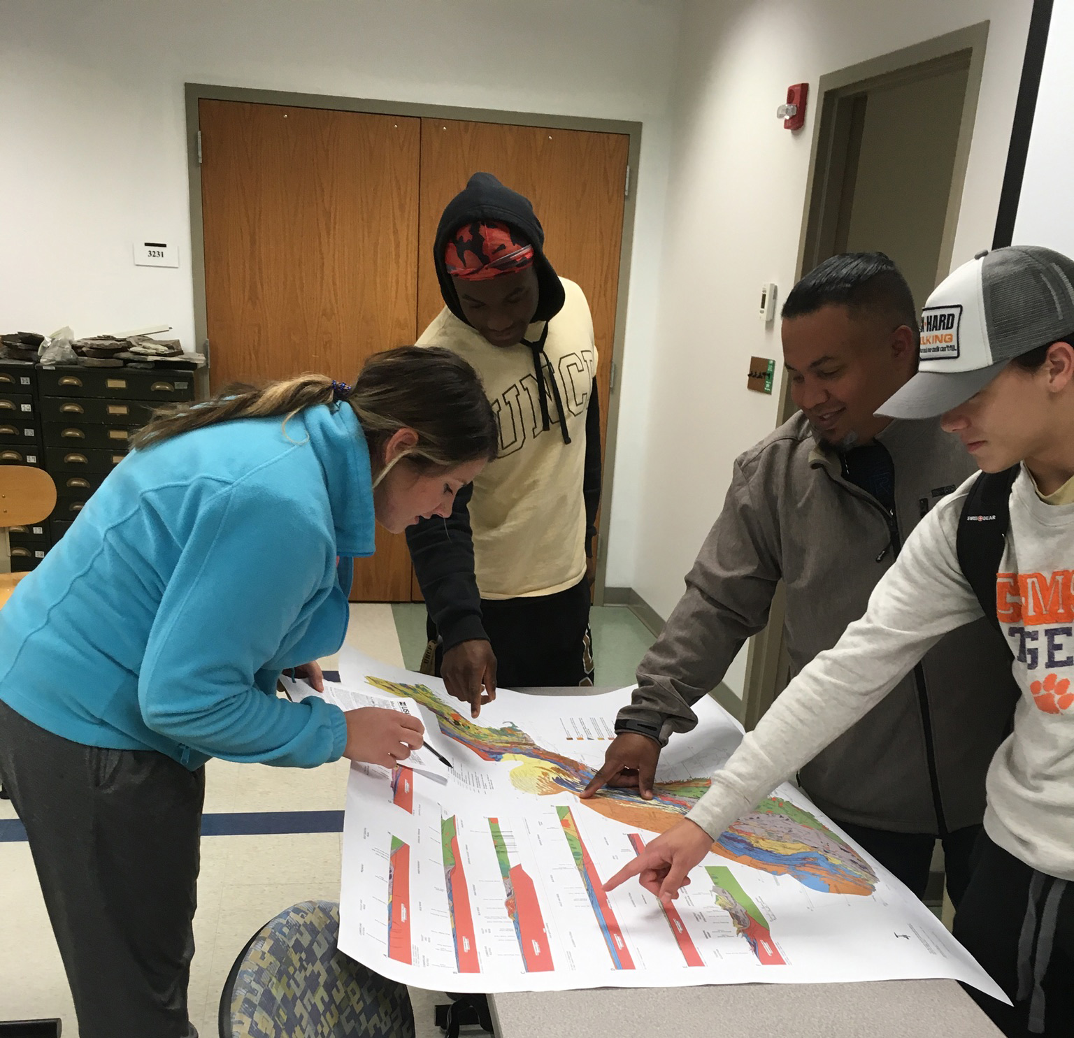 UNCP Geo-Environmental Studies students viewing a geographical map