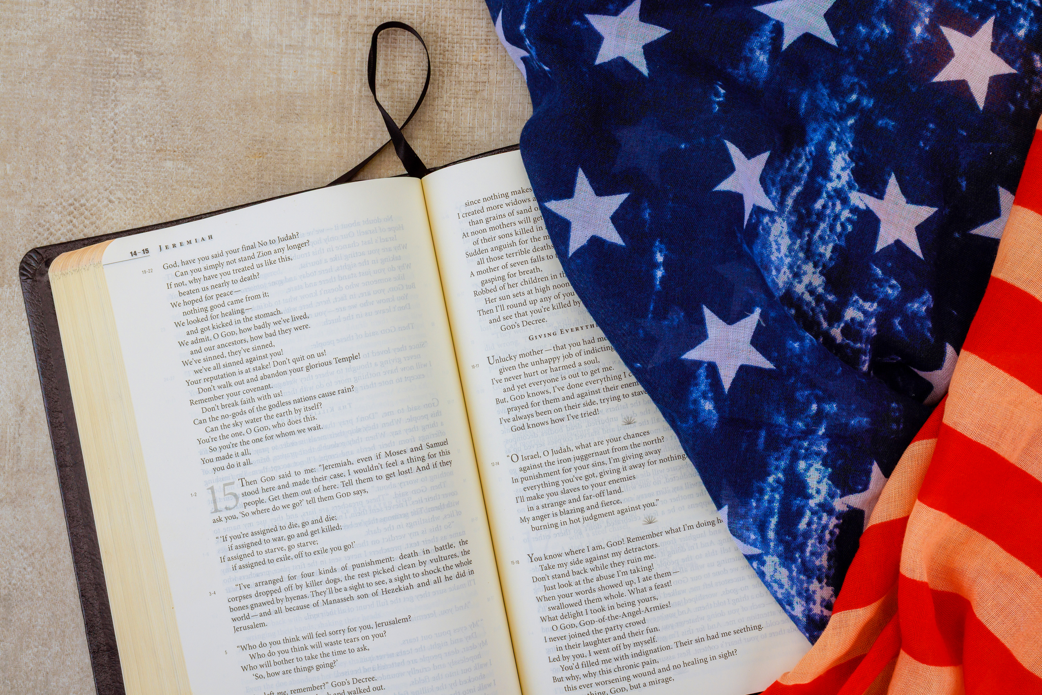 Bible with an American flag on top of it