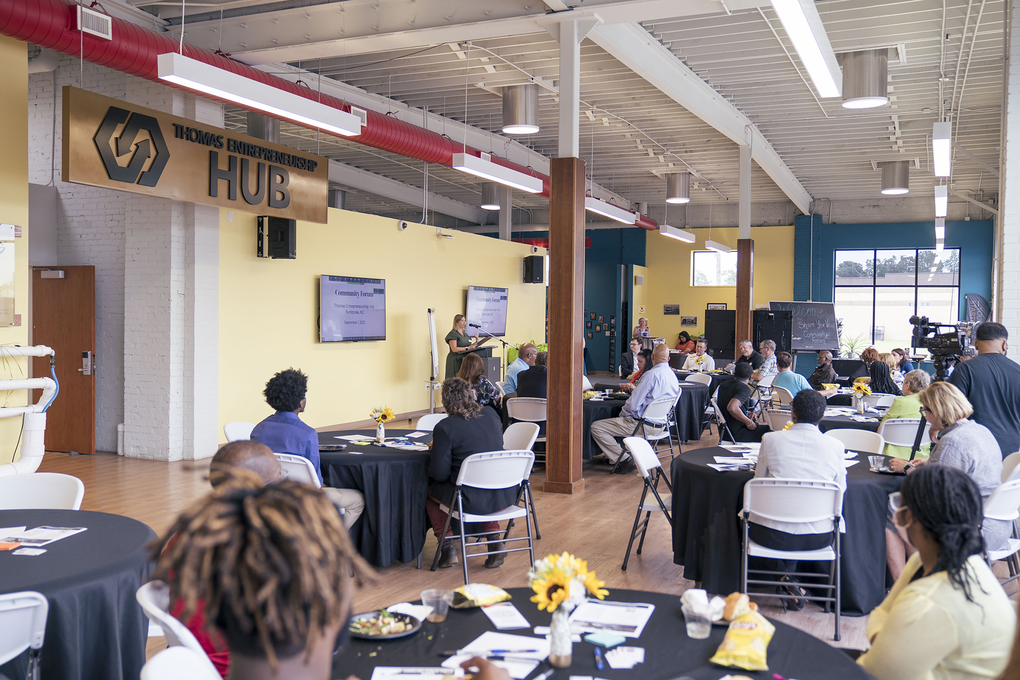 people at a meeting at the HUB