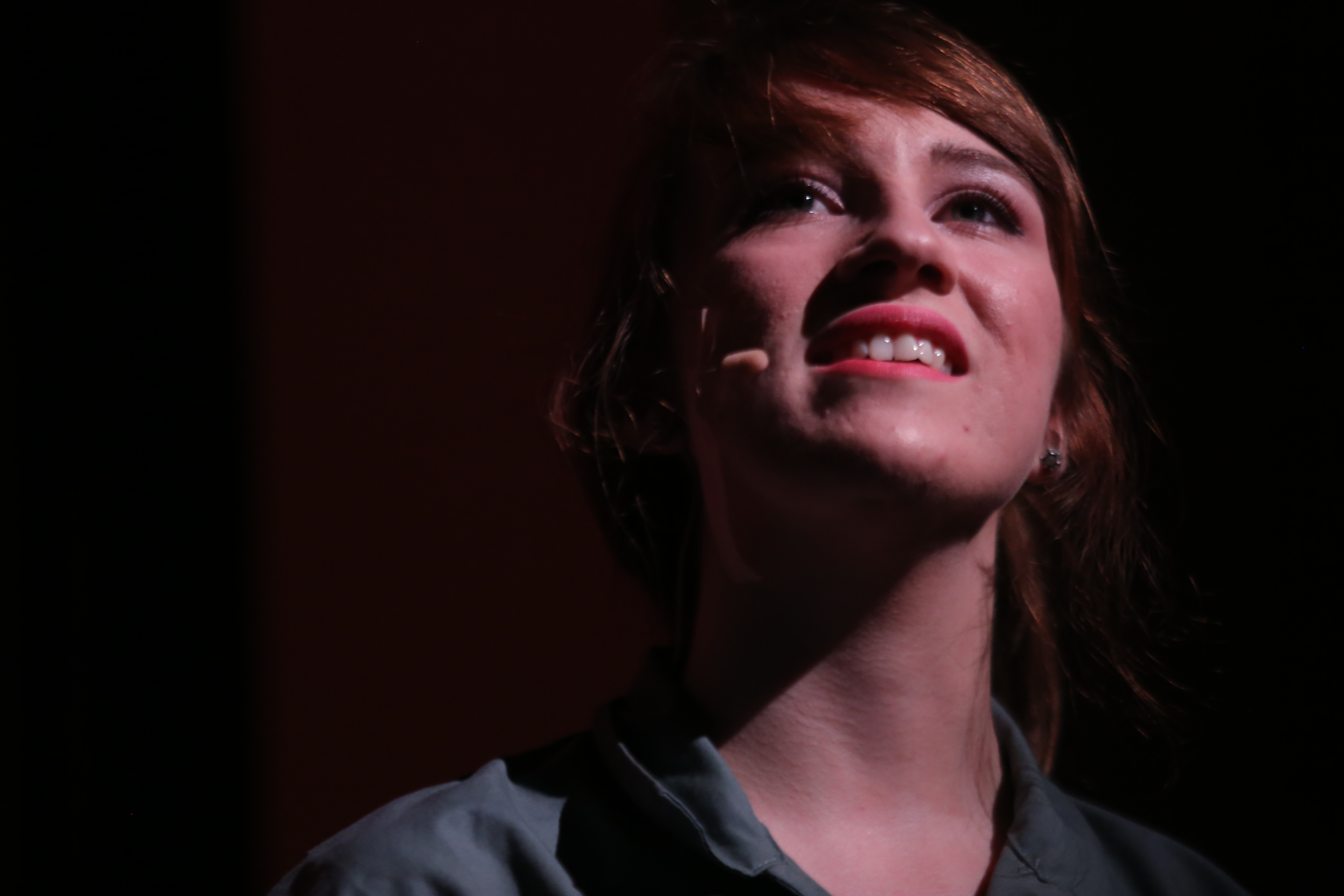 female student singing on stage at UNCP