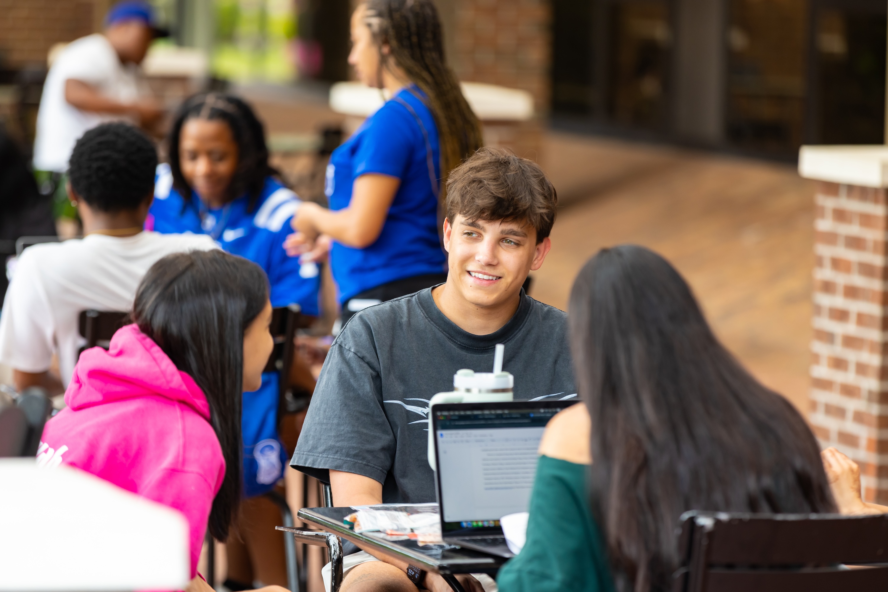 students at table UNCP campus