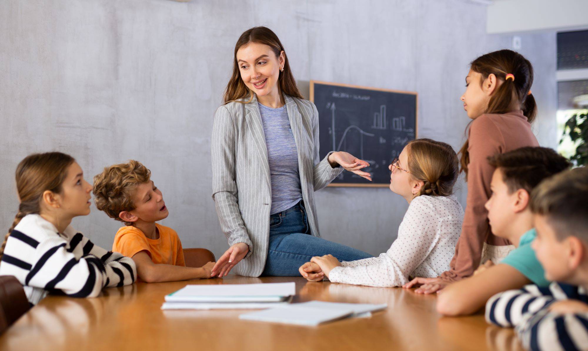 Teacher surronded by a group of students