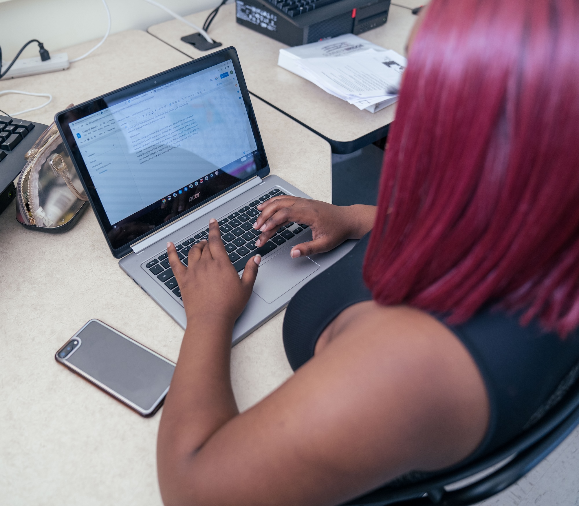 UNCP student on a laptop writing a paper
