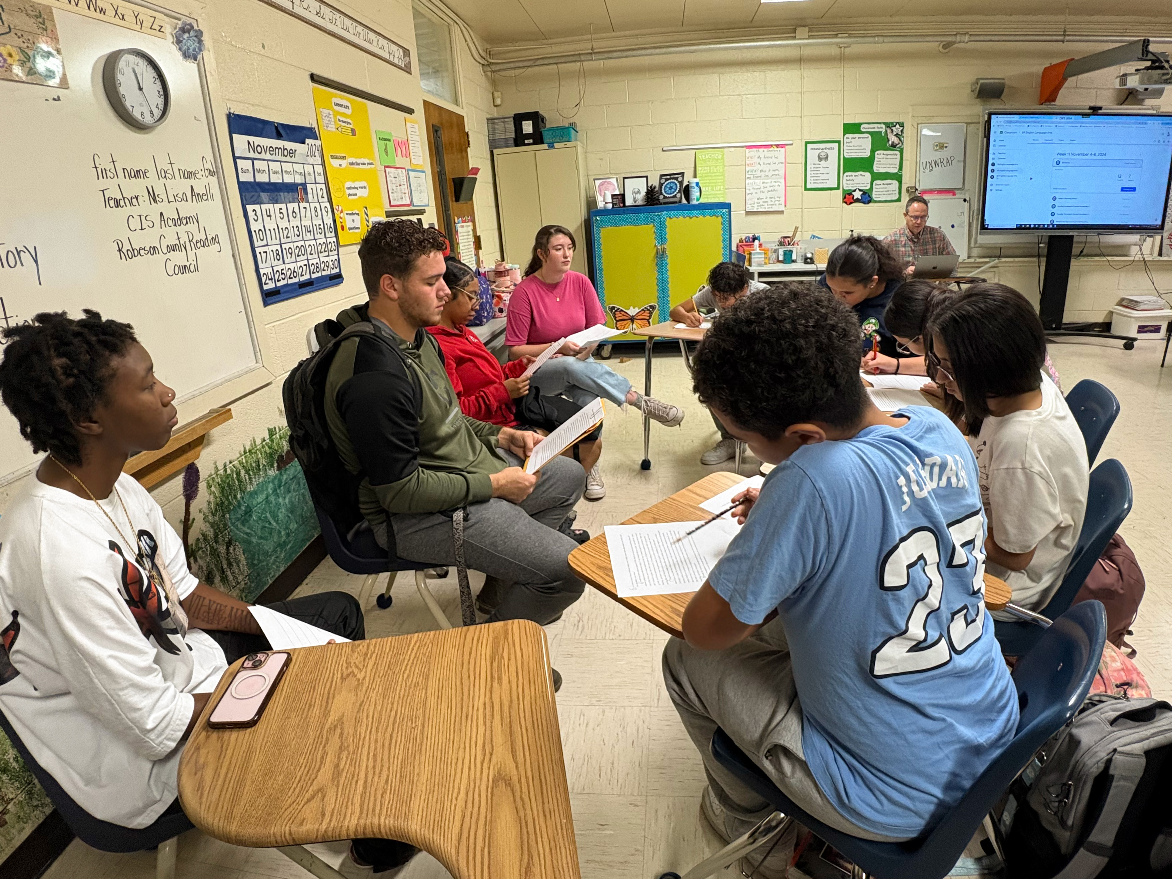 UNCP students working with public school youth for a service learning class.