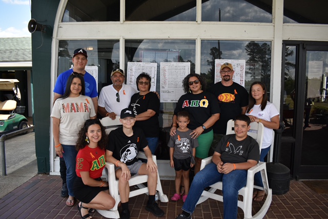Jacob Worriax (seated with hat) surrounded by his parents UNCP alumni James and Jessica Worriax and several family members