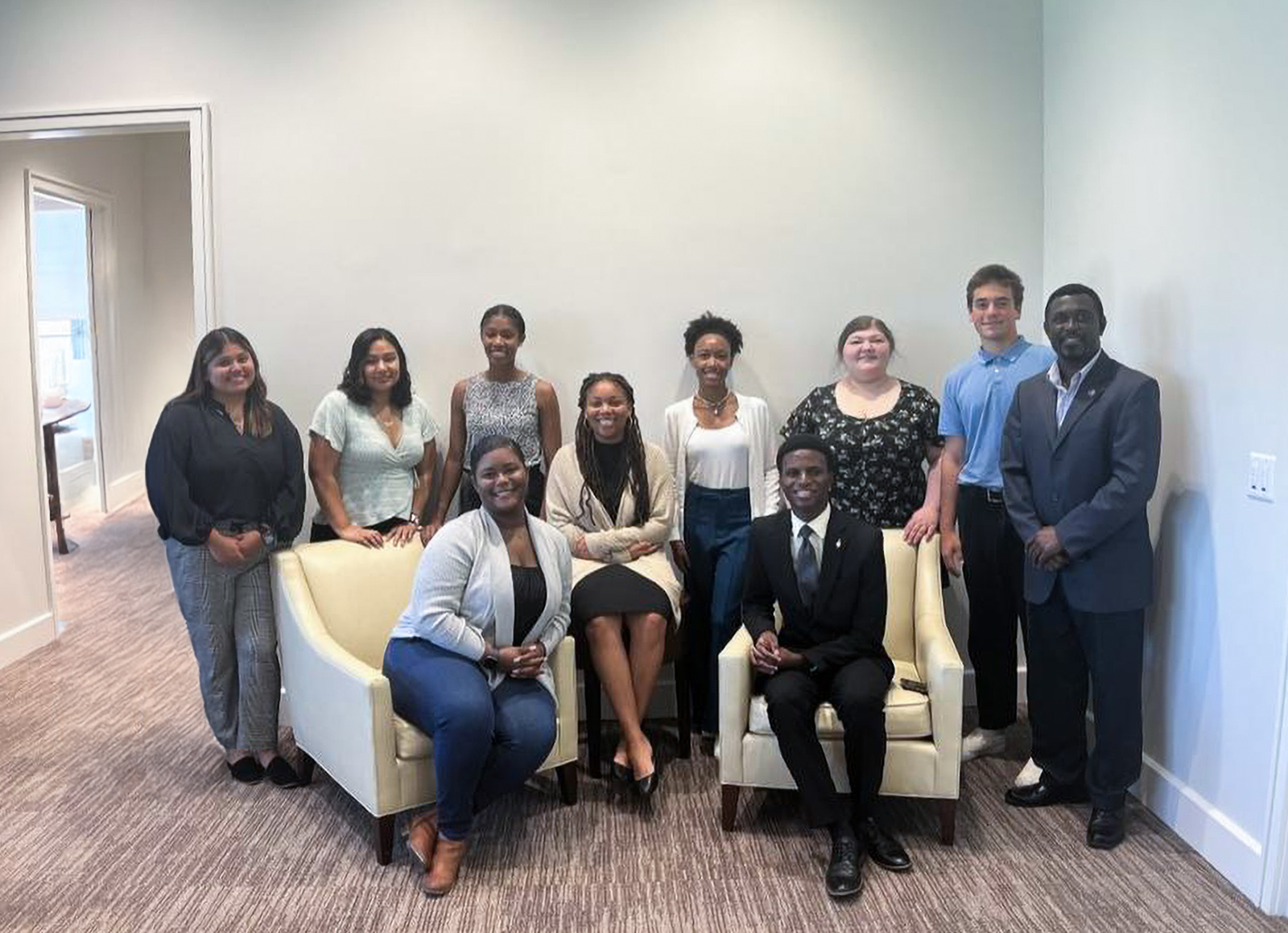 Dean's Student Advisory Board group photo with nine student members and a faculty member.