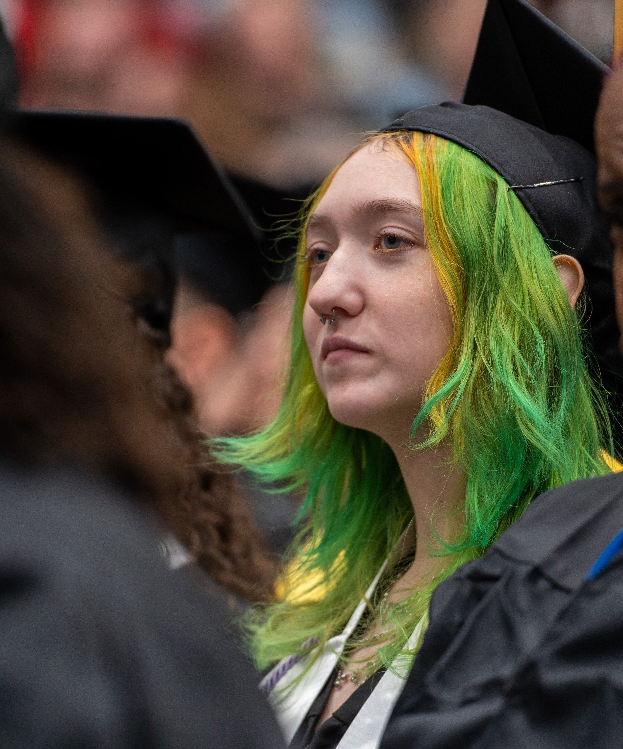Art student, Bethani Paul, in her cap an gown at winter commencement.