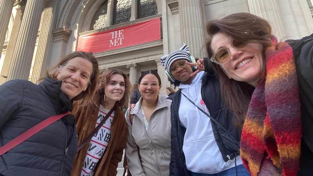 UNCP art students and faculty stand outside of The MET.