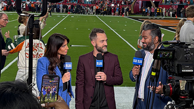 Sideline reporters during a college football game
