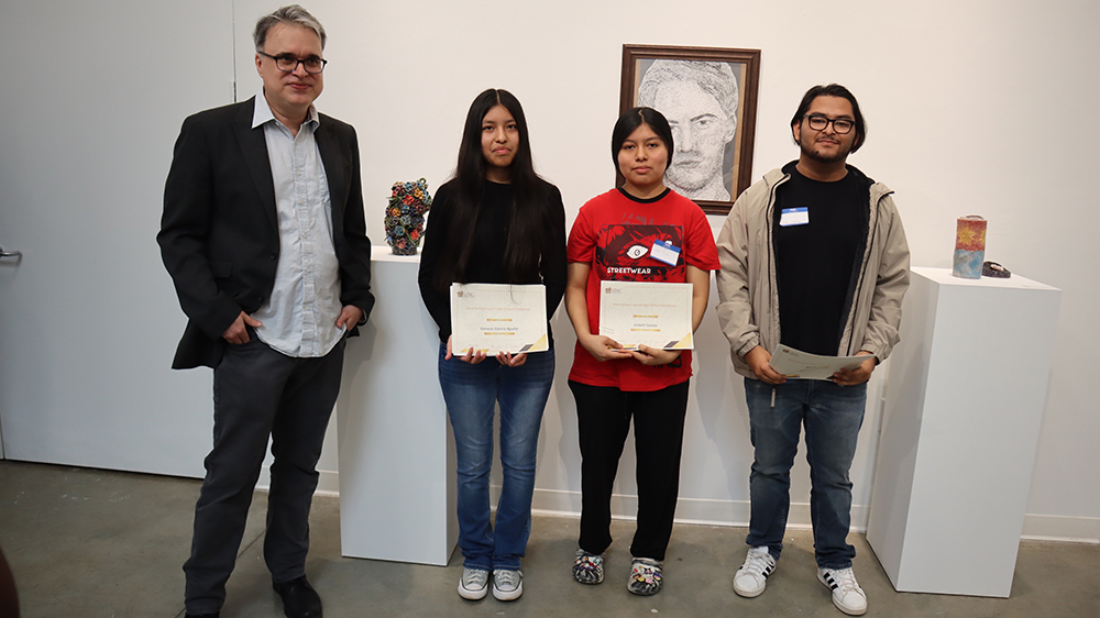 Joseph Begnaud (left) with winners, Genesis Garcia Aguilar, Lisbeth Santos and Cesar Medina  