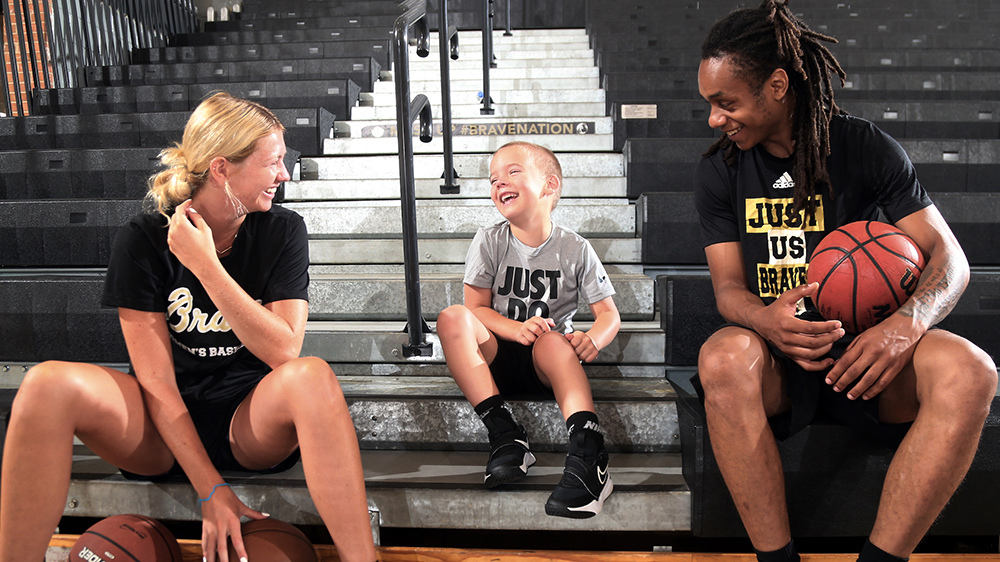 Kelci Adams (left) and Bradlee Haskell entertain a youth