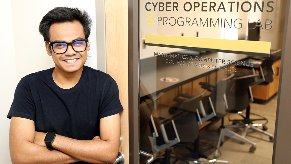 Shirsendu Mondal in front of the Cyber Operations Programming Lab 