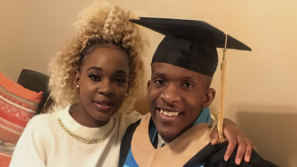 Paula Mukau and her brother, Sam, at his graduation ceremony at UNCP in 2021