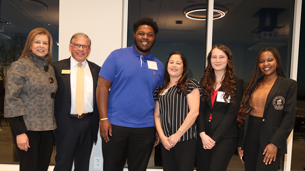  UNCP First Lady Rebecca Cummings, far left, and Chancellor Robin Gary Cummings are pictured with UNCP students Amari Chance, Tasha Locklear, Olivia Peal and Anesu Mavihya