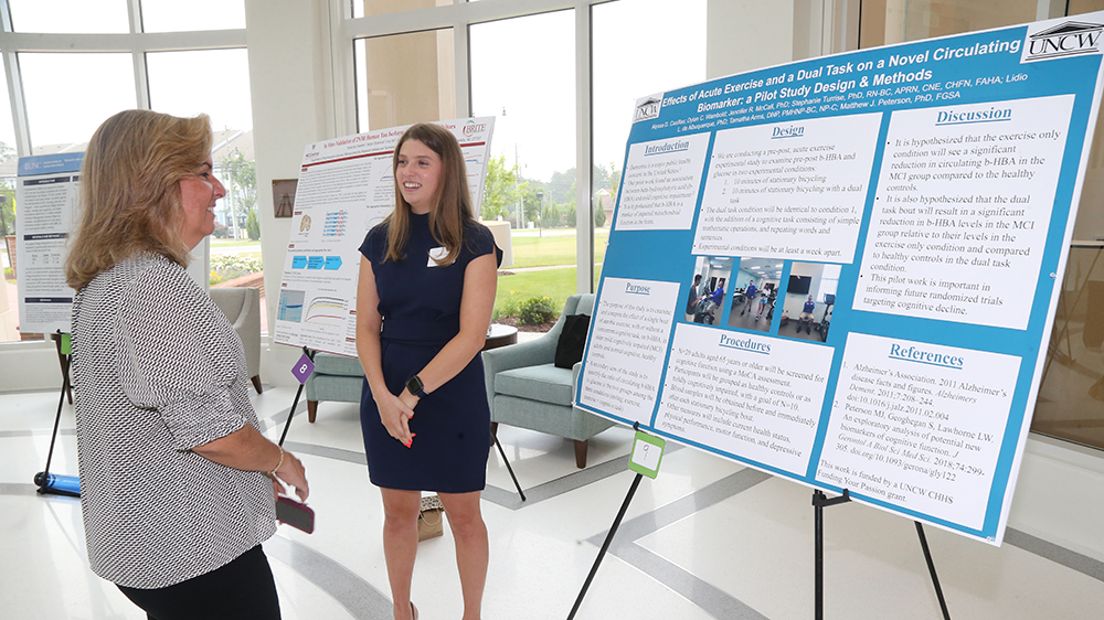  UNCW student, Alyssa Casillas, presenting at the Duke/UNC SLAM DUNC conference at UNC Pembroke