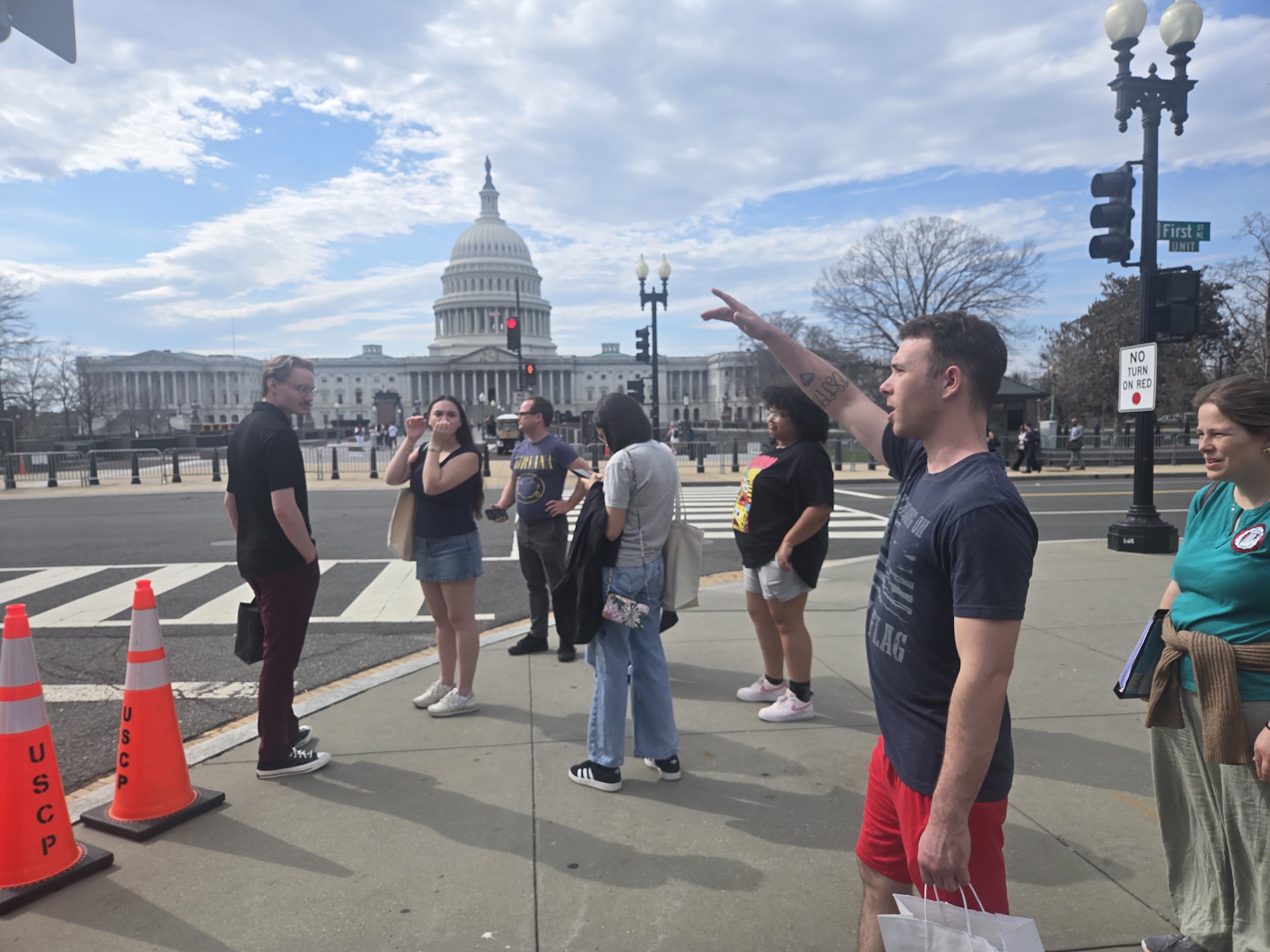 UNCP students on Study Away trip walking on the sidewalk in front of the U.S. Capitol building in Washington, D.C.