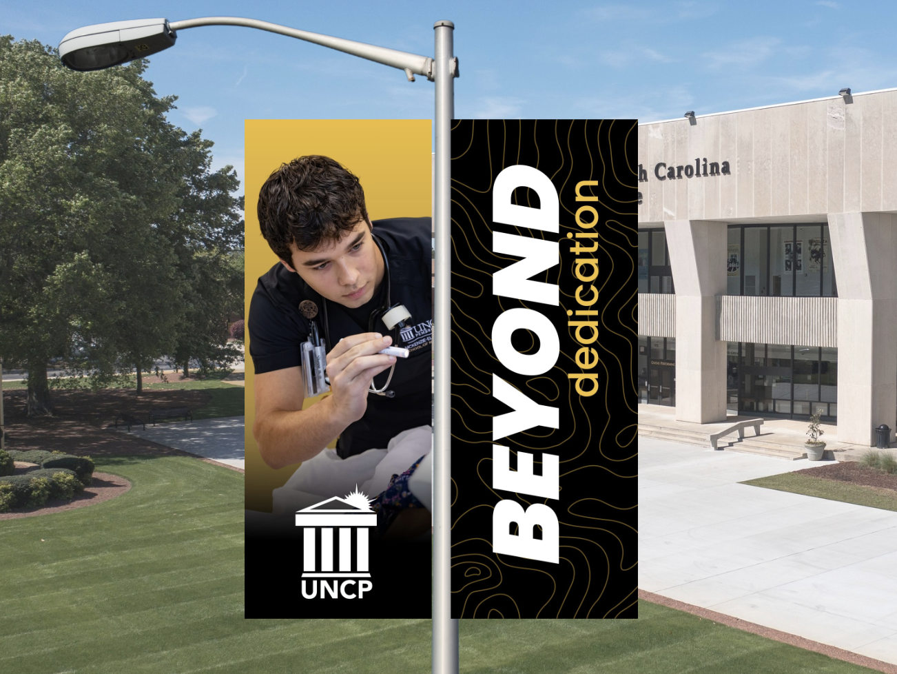 UNCP Banners on campus that read "Beyond Discovery"