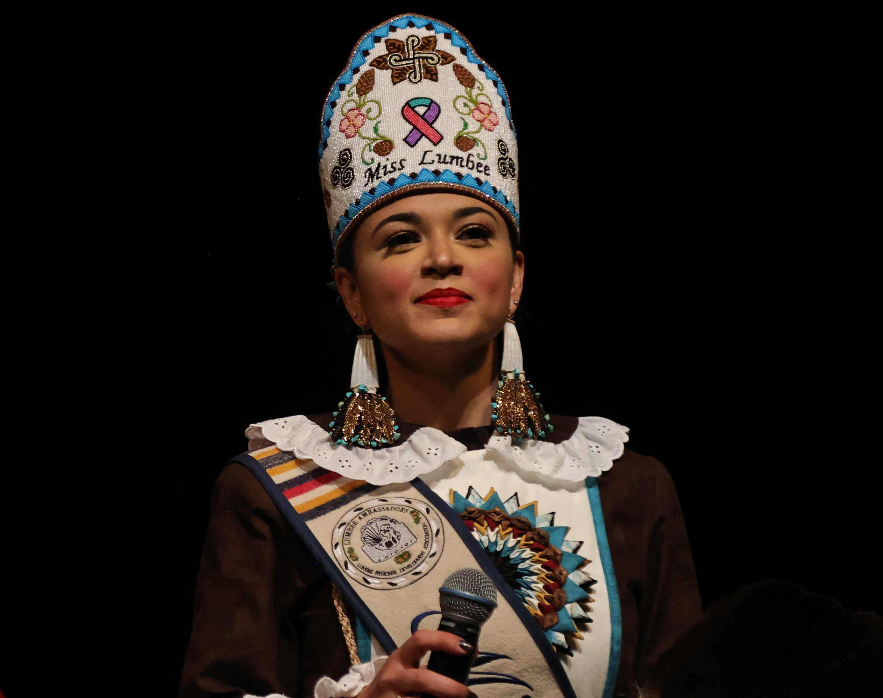 Taylor Davis, Miss Lumbee, speaks during the Lumbee Cultural Showcase.