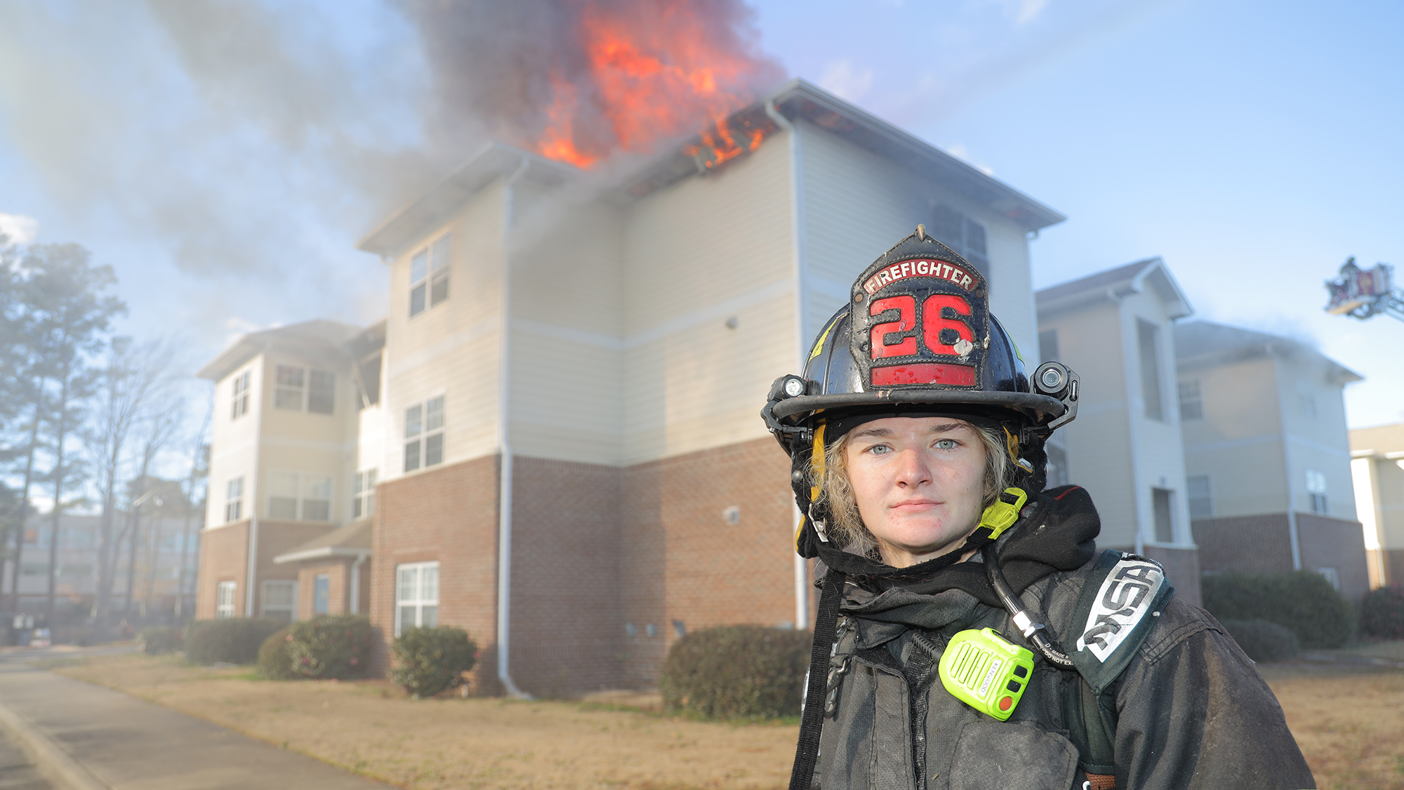 Firefighter Anna Grossheim looks on as the control burn is started