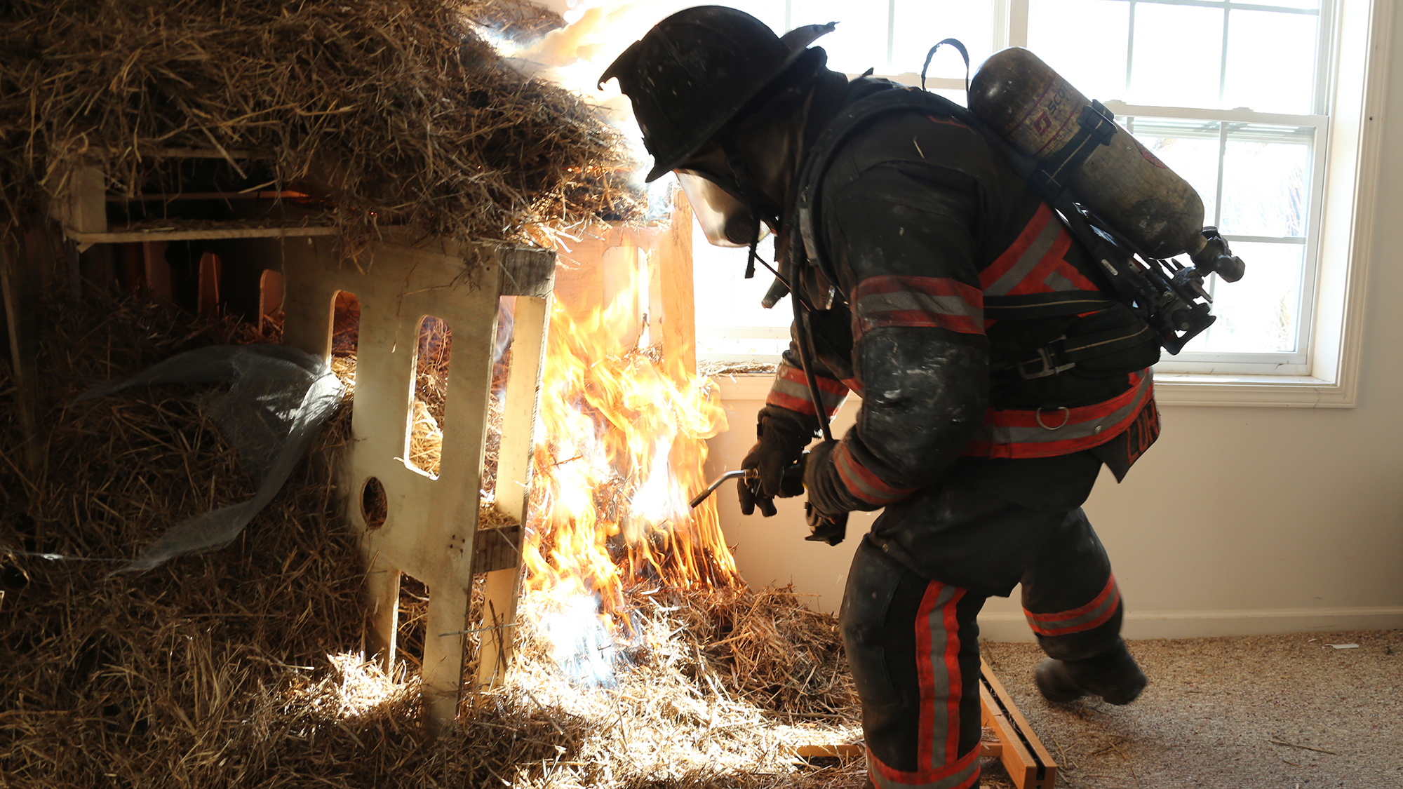 Firefighter begins the controlled burn