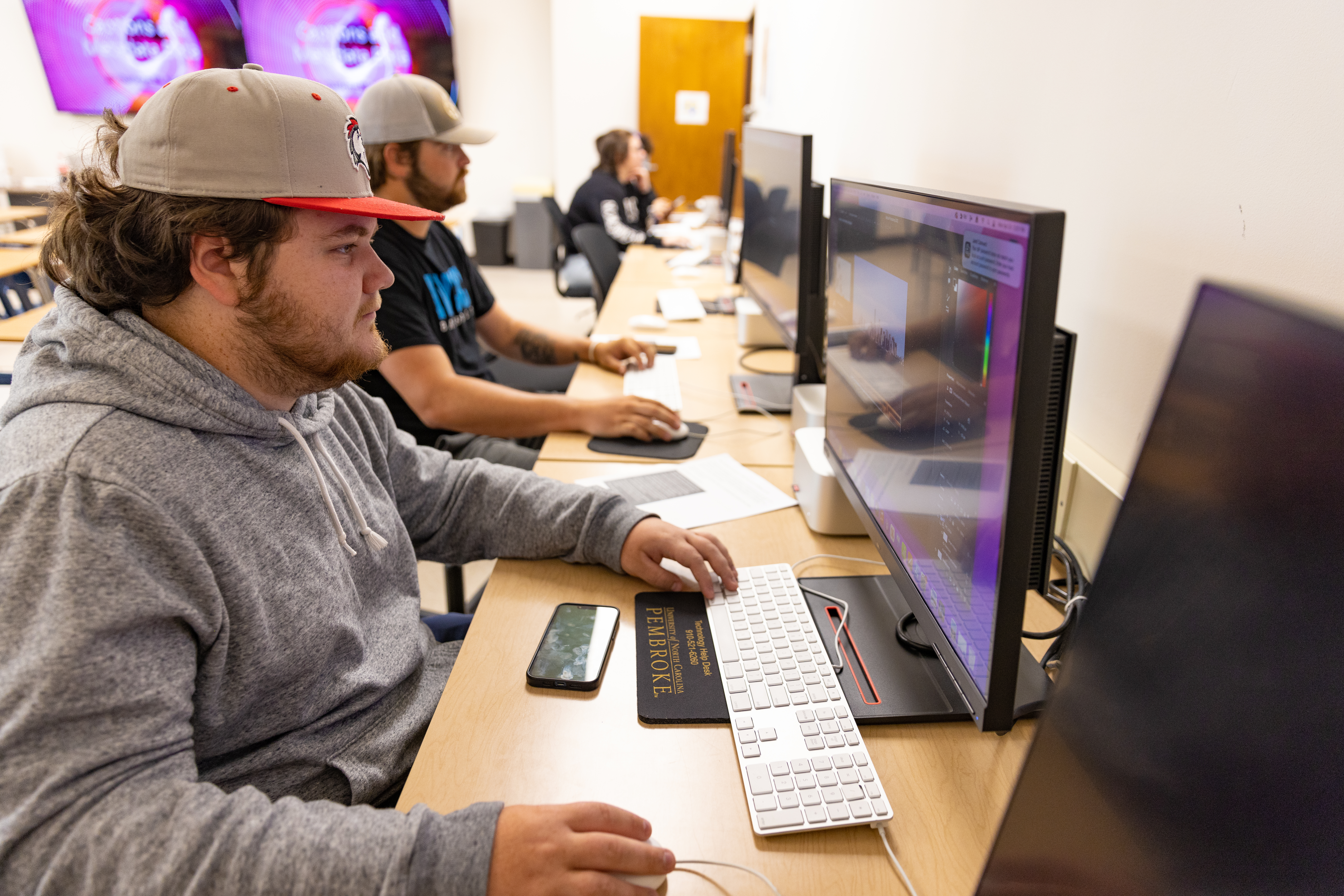 students at computers in newspaper classroom