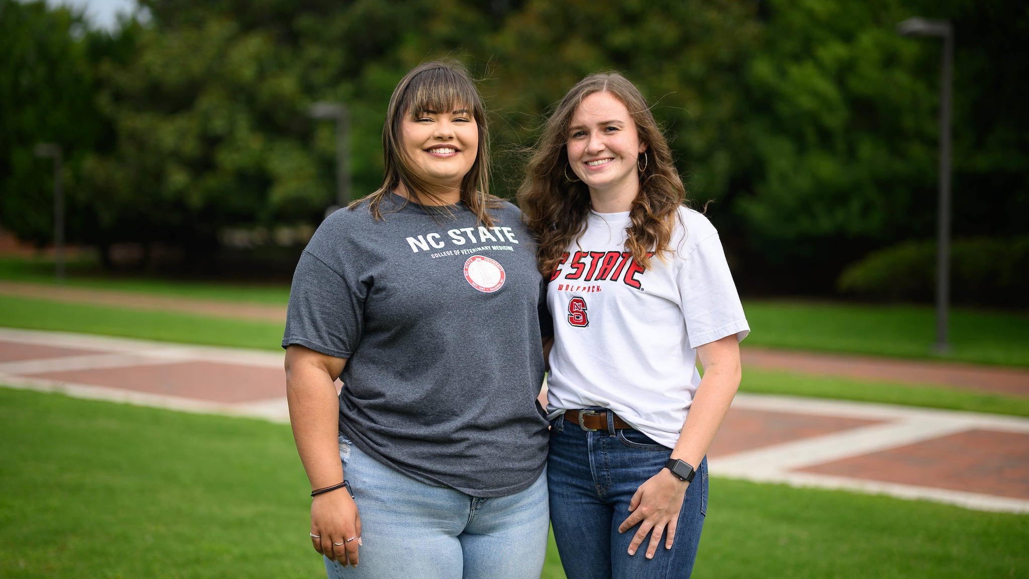 Allyson Chavis and Allyson Lane on the practice field in NC State t-shirts representing the Health Careers Access Program