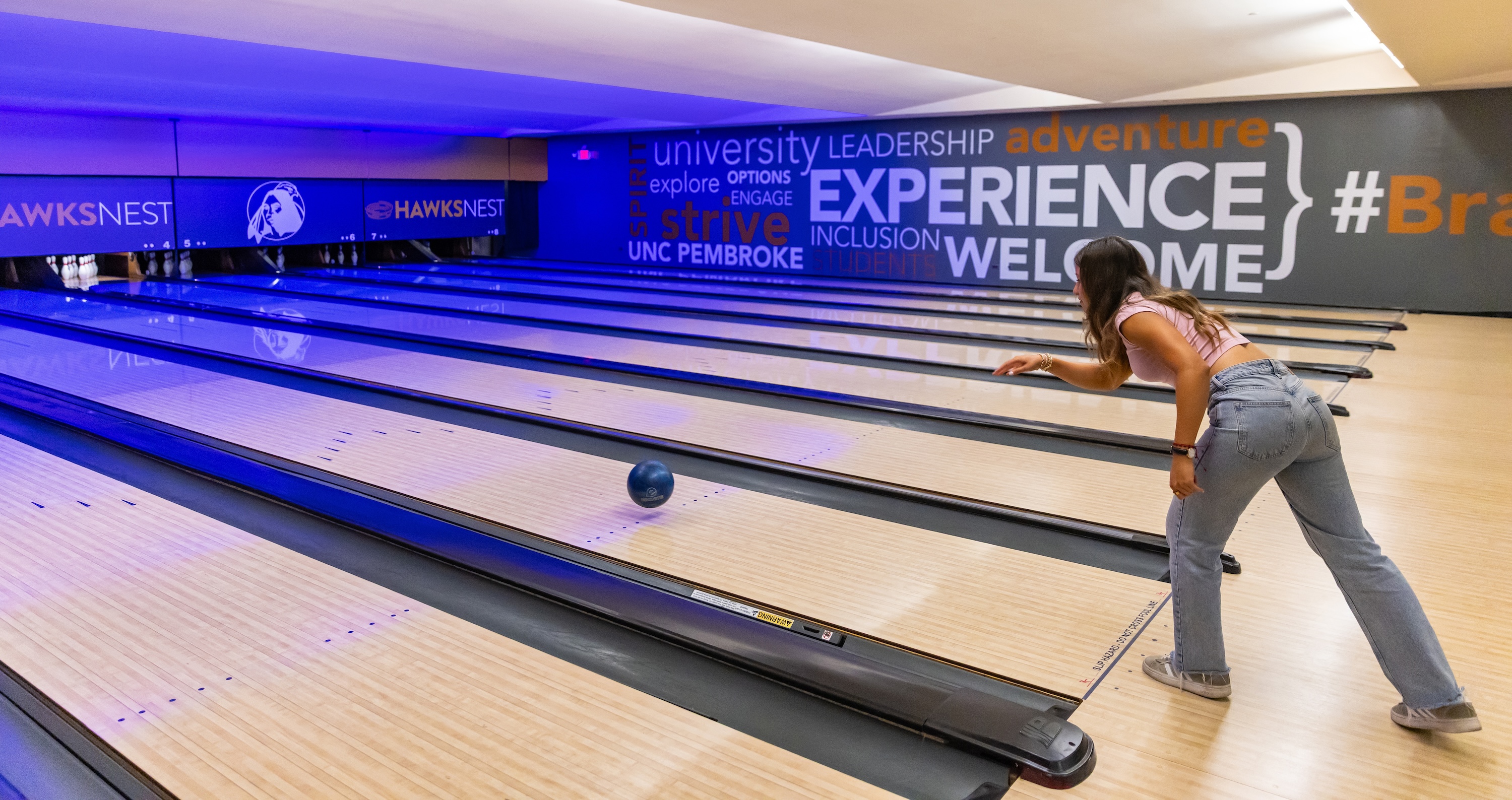 Girl bowling UNCP Hawks Nest