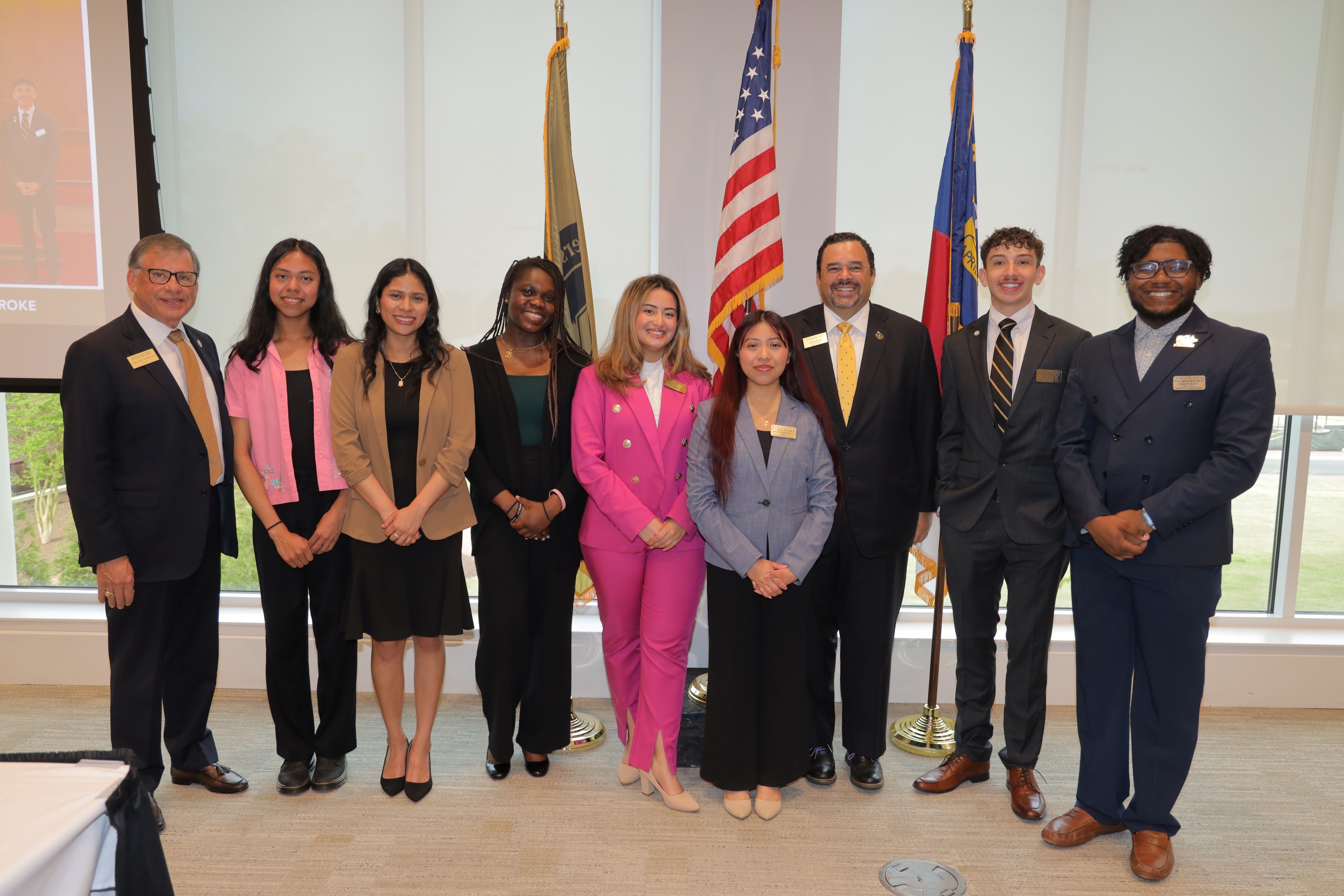 SGA President representing students with the Board of Trustees. This is a group photo of the Board of Trustees that includes the SGA president at UNC Pembroke.