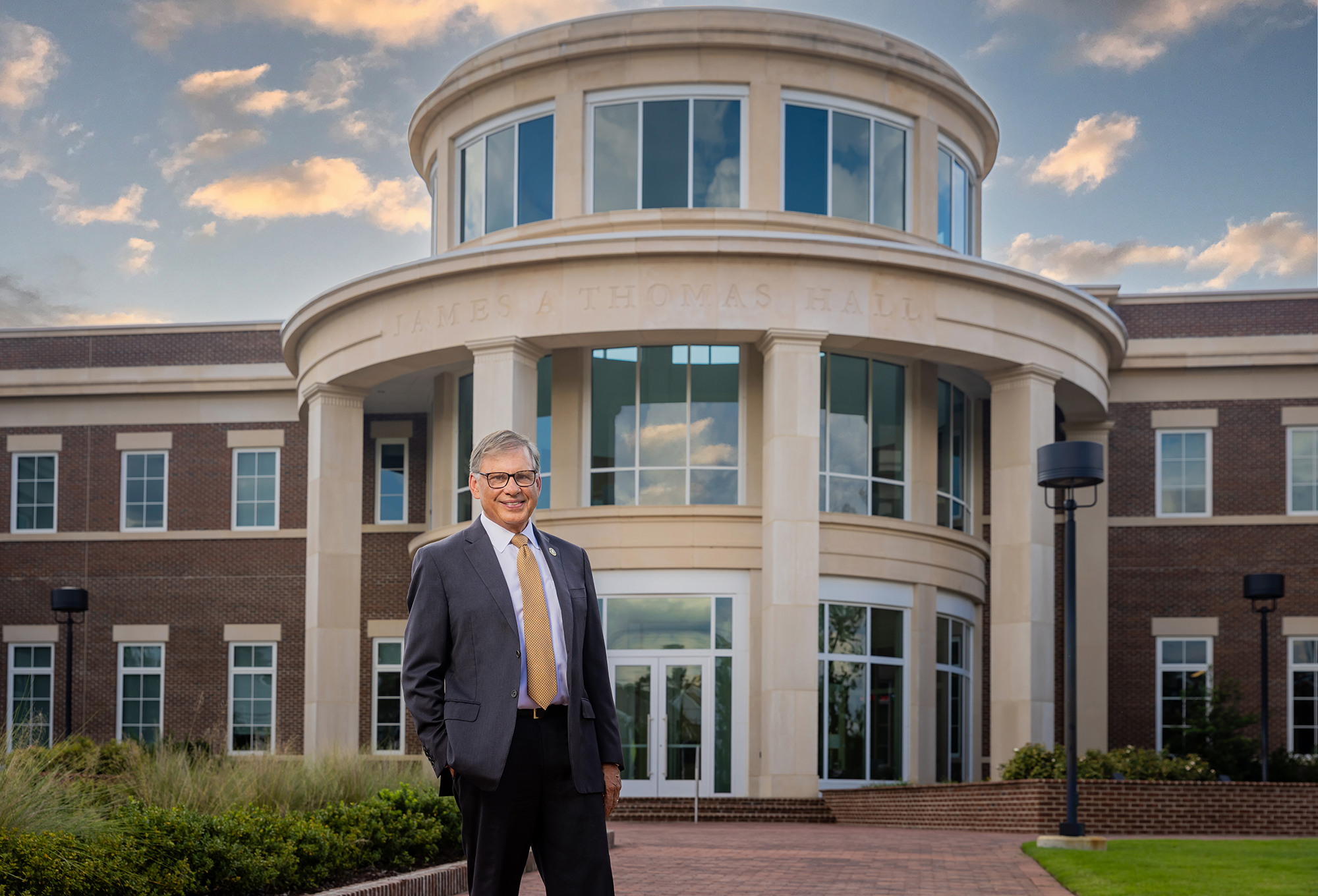 Chancellor Robin G. Cummings in front of James A. Thomas Hall