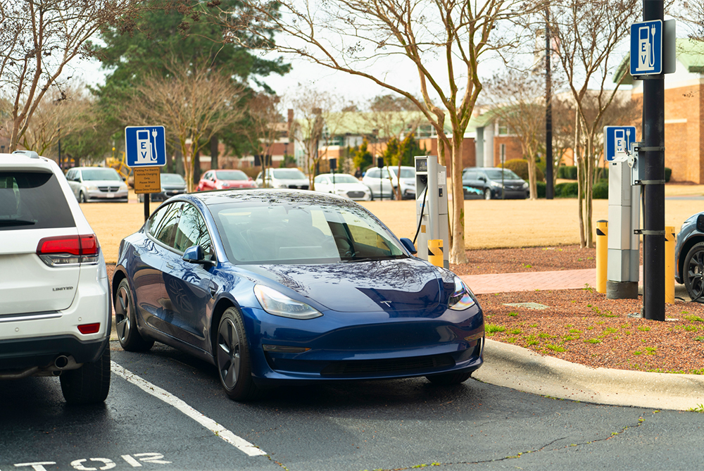 UNCP Campus EV parking space with blue car