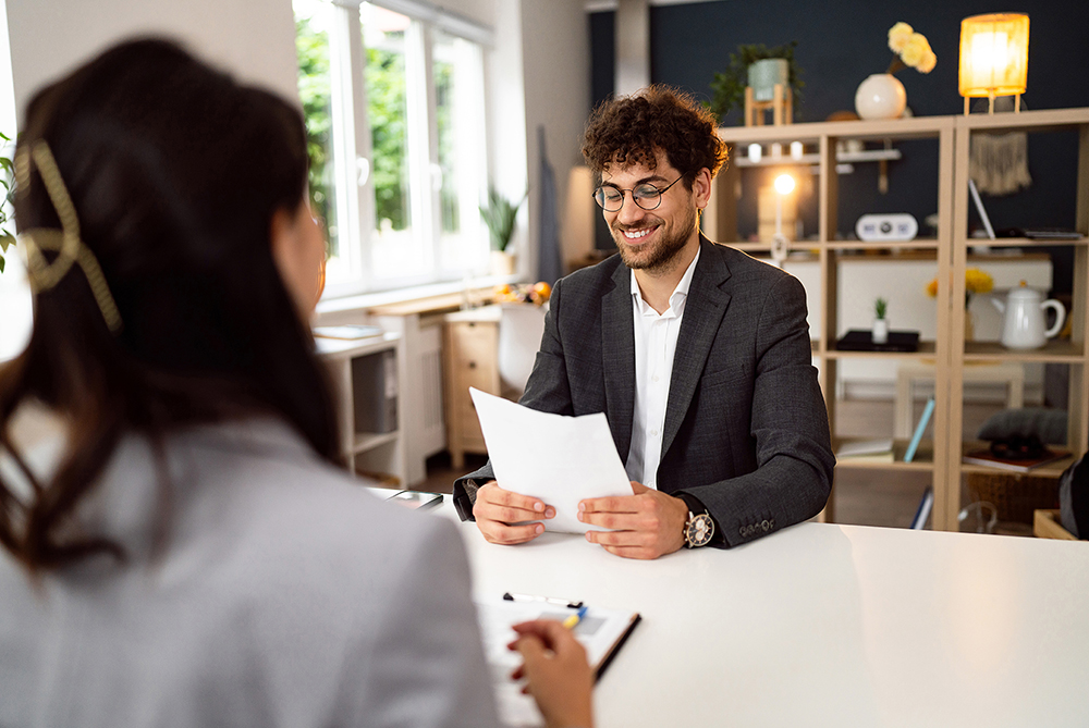 man smiling during an interview