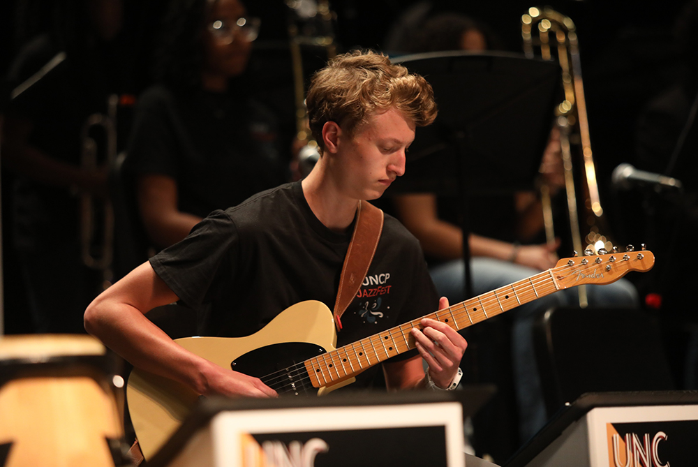 student male playing at jazz festival