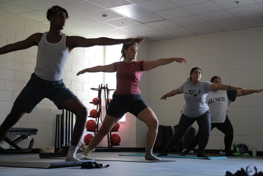 UNCP students in a yoga class