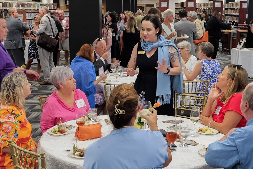UNCP event where people are talking around a table