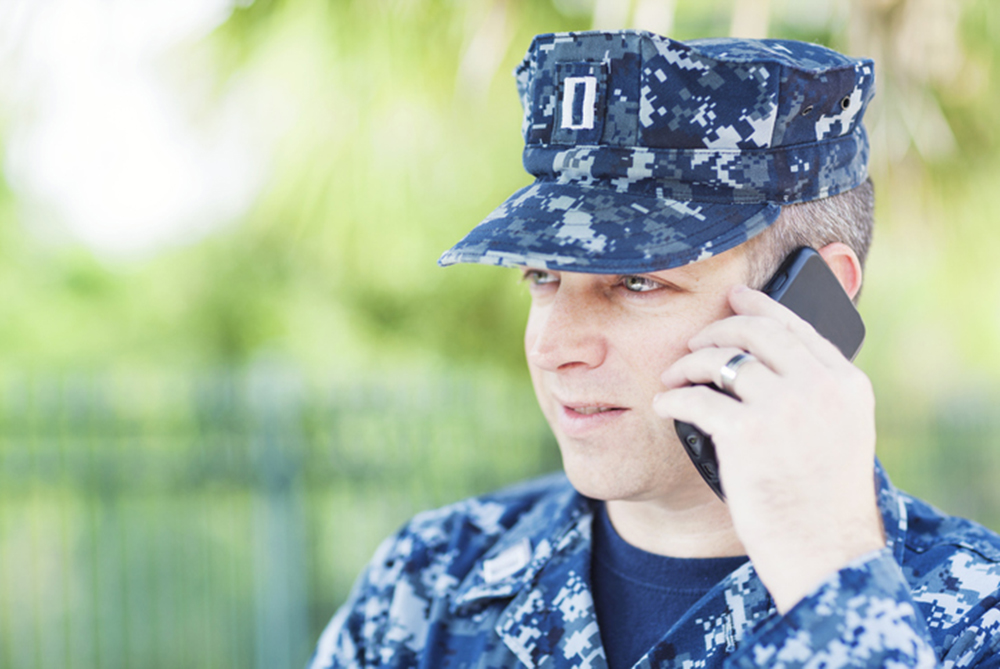 United States Naval Lieutenant talking on smart phone.